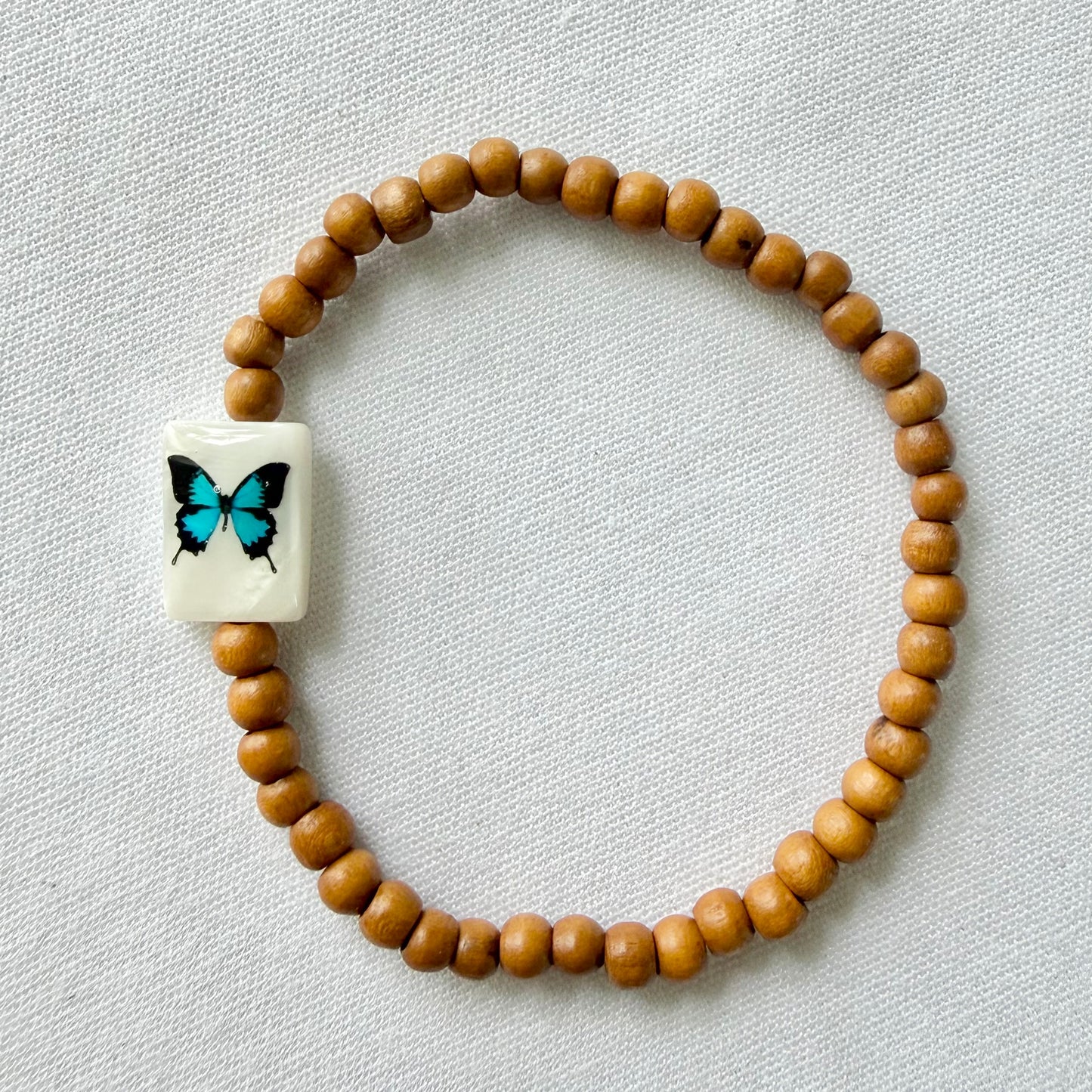 Wooden bracelet with butterfly