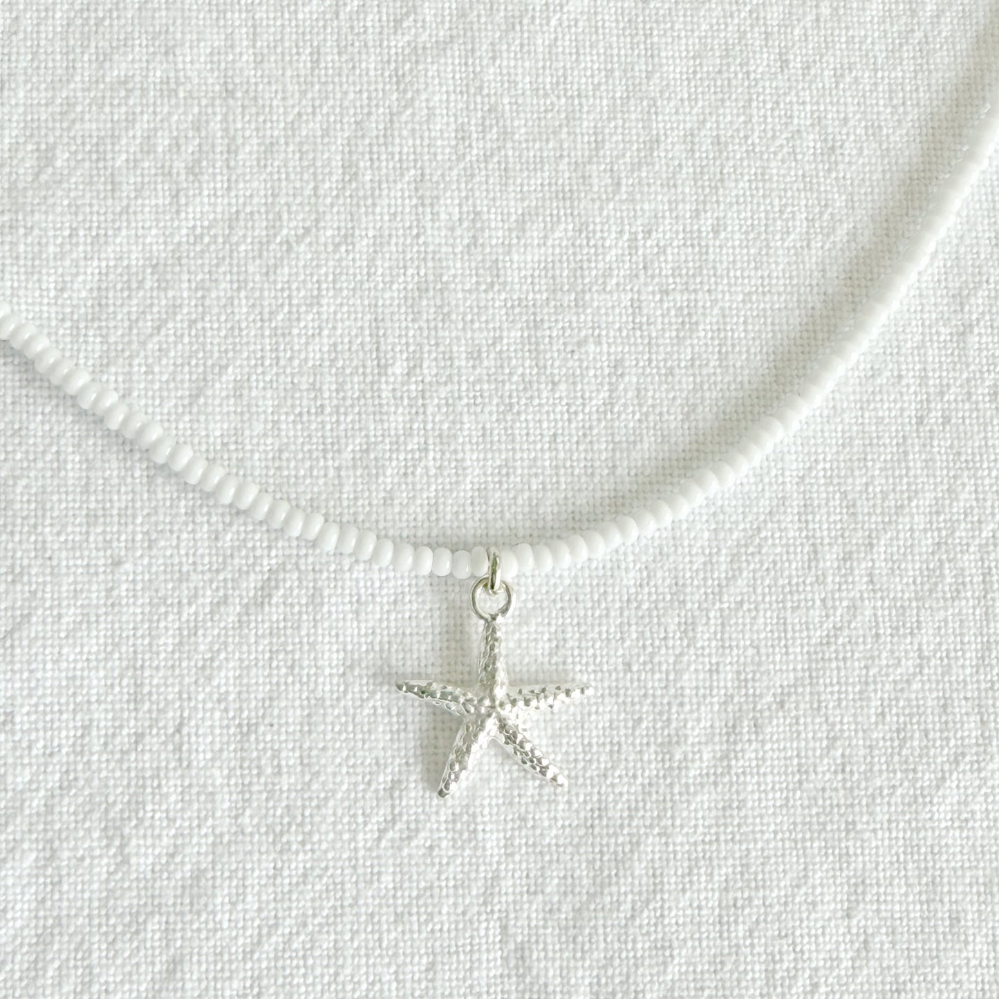Starfish on white glass beaded necklace
