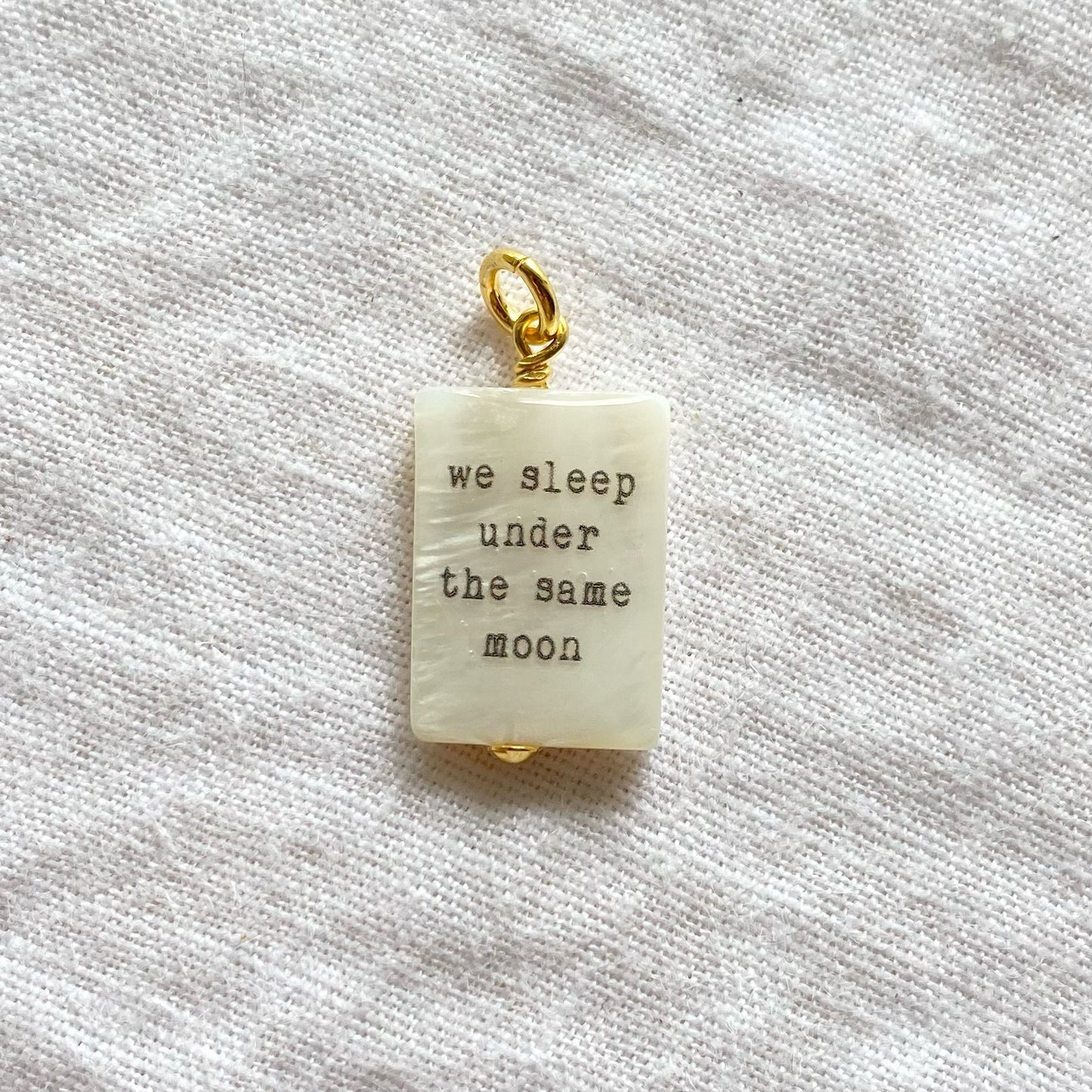 We sleep under the same moon pendant