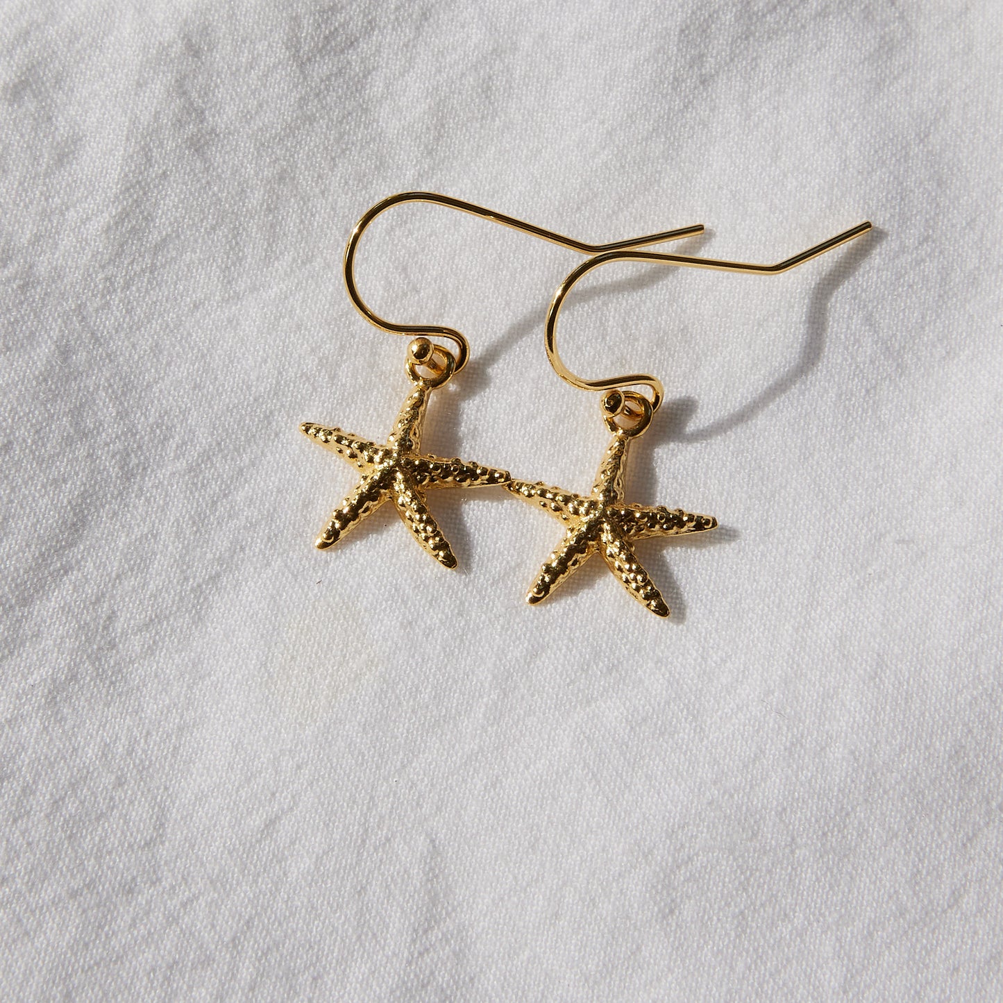 Boucles d'oreilles crochet or étoile de mer