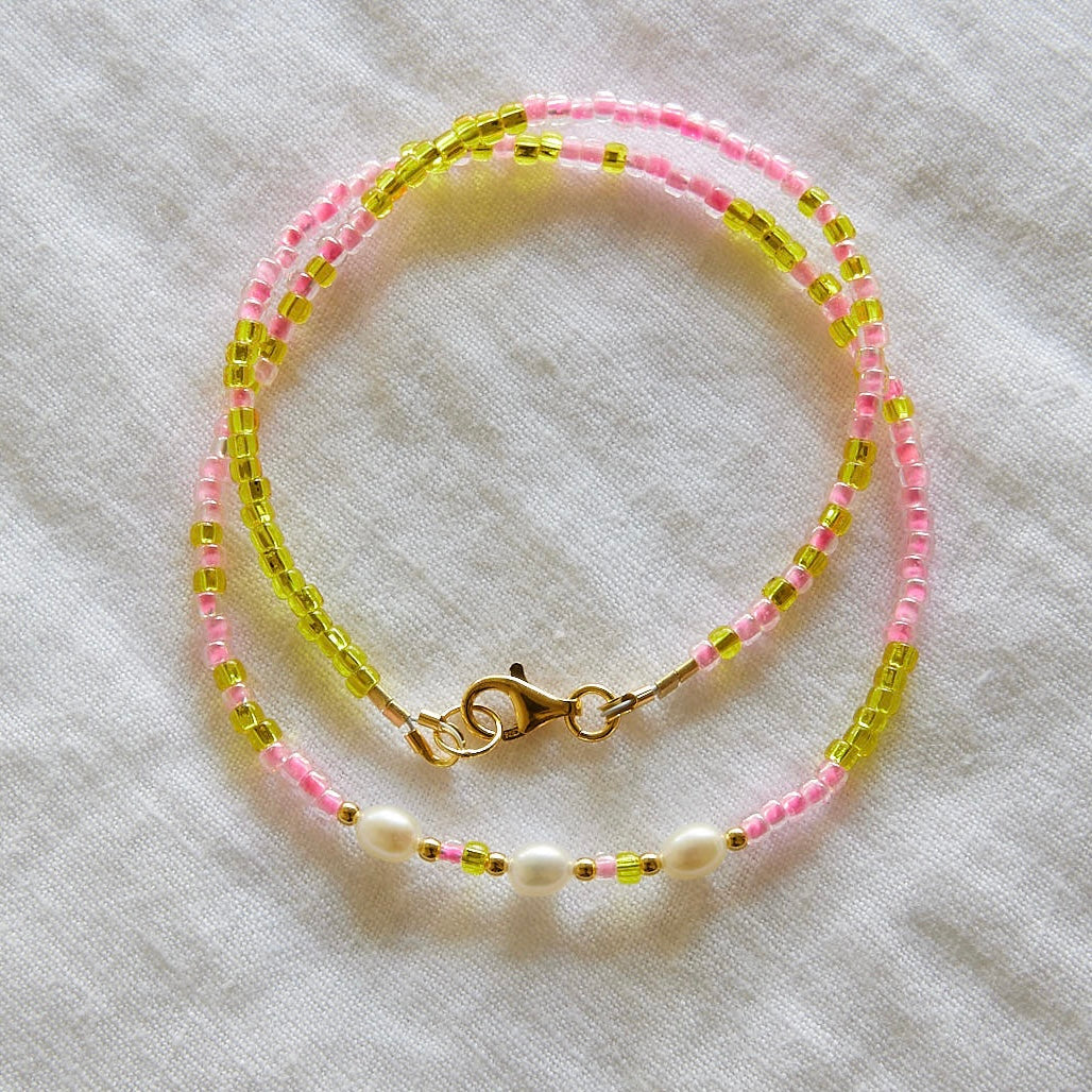 Collier de perles ciel rose