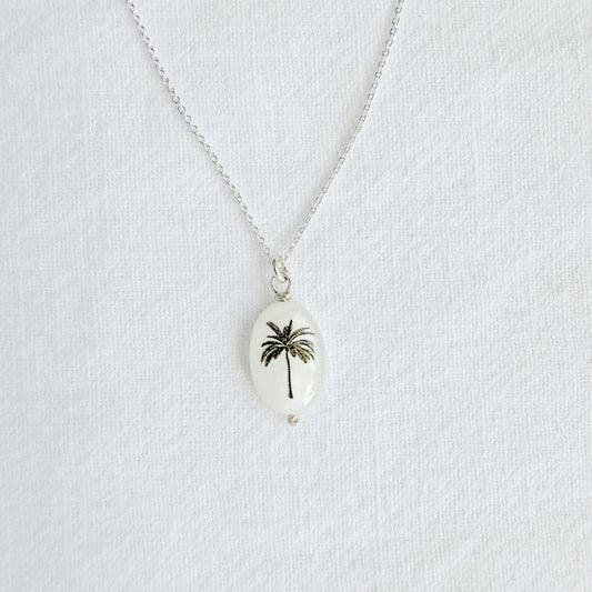 Silhouette oval palm tree on sterling silver chain