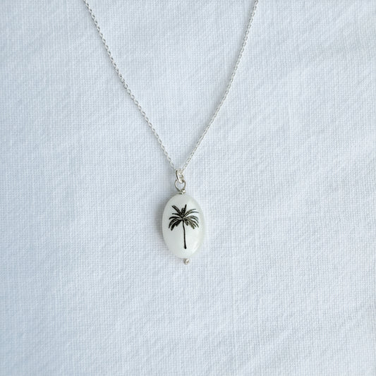 Silhouette oval palm tree on sterling silver chain