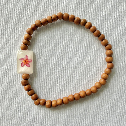 Wooden bracelet with pink frangipani