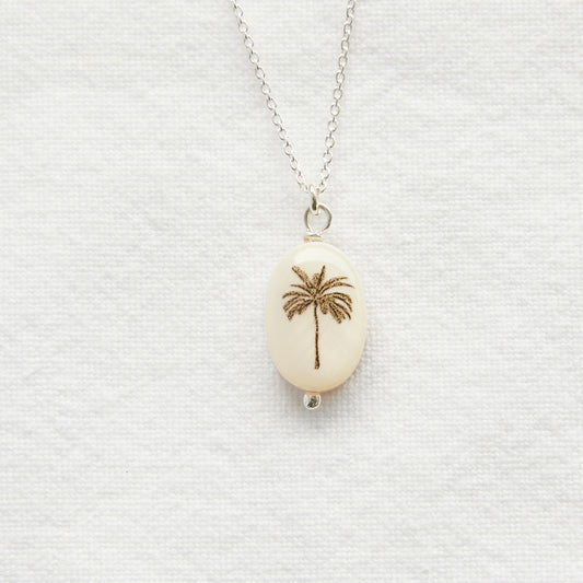 Silhouette oval palm tree on sterling silver chain